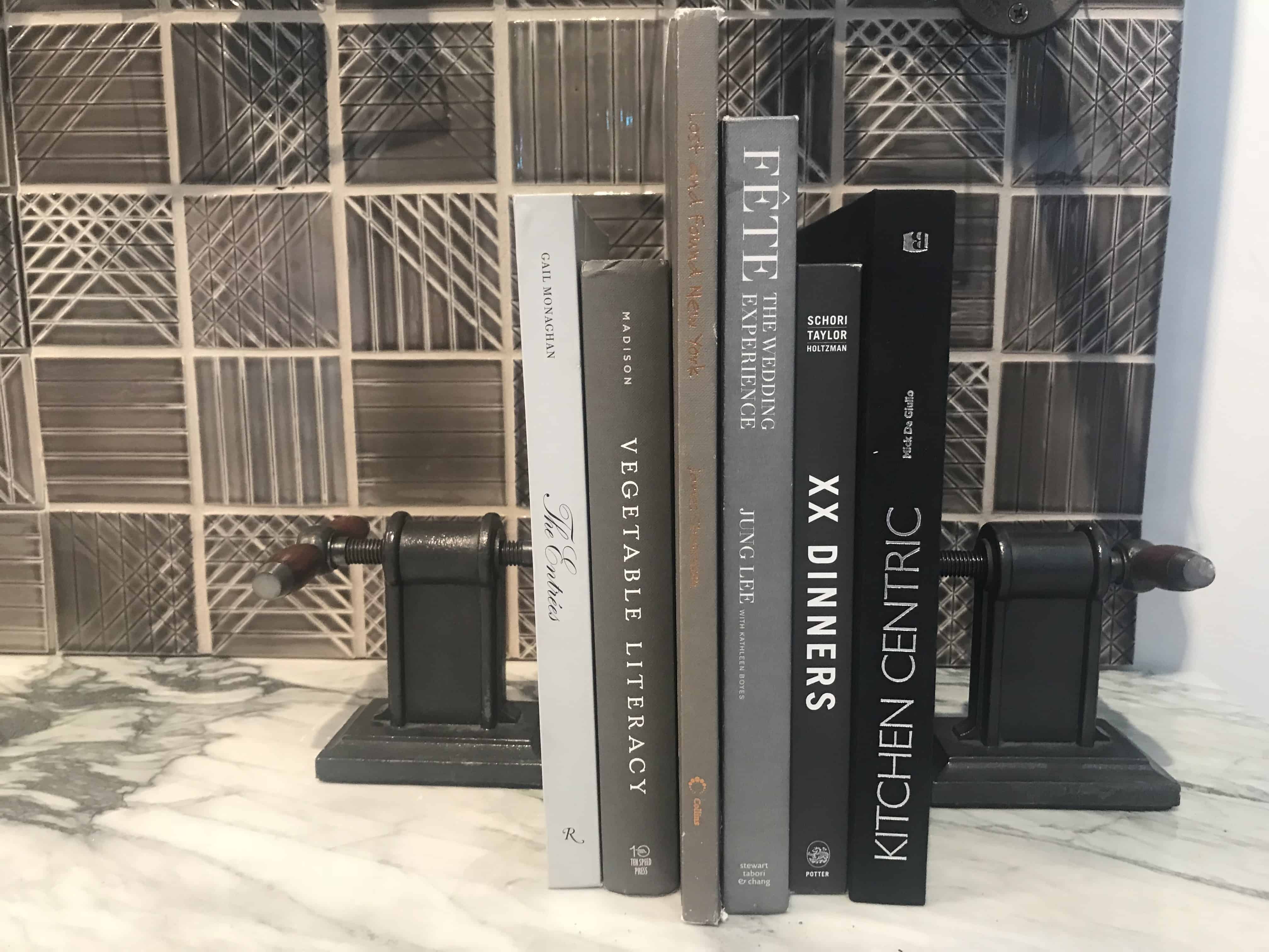 Vise grips as bookends add a Steampunk element to this kitchen design by Brizo