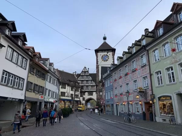 a street with buildings and a clock tower