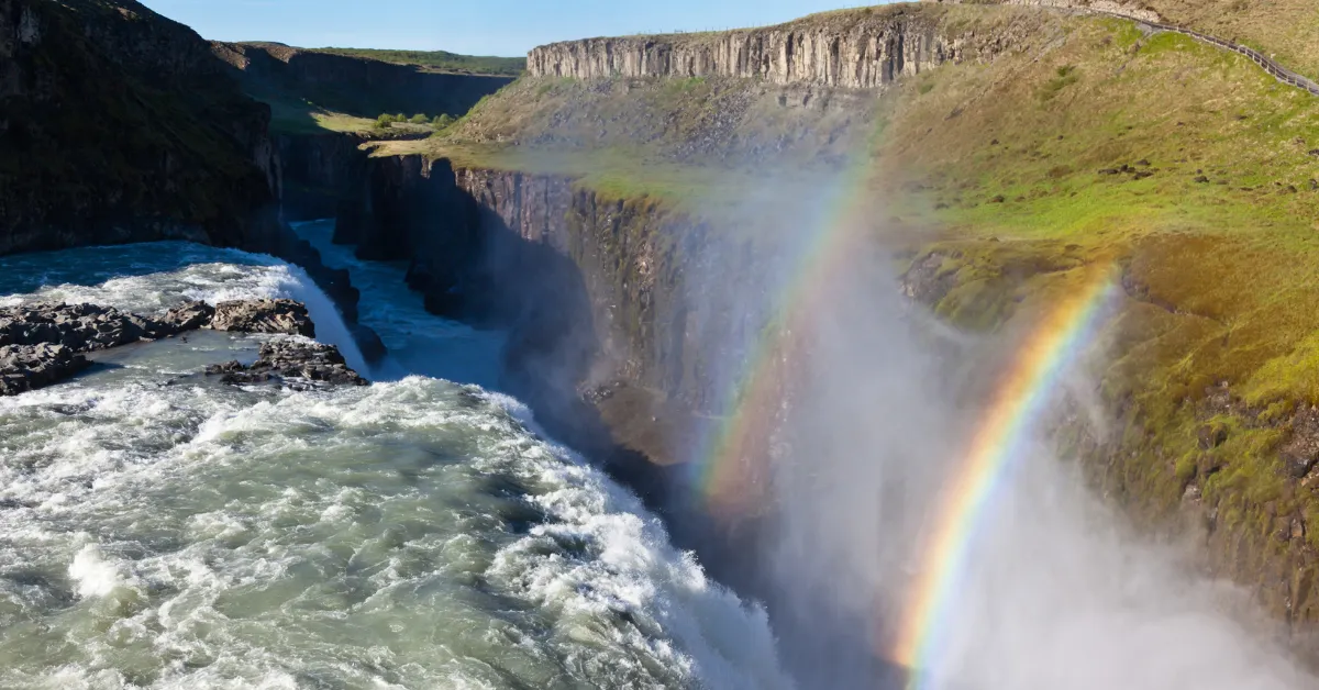 A rainbow over a waterfall of Gullfoss.