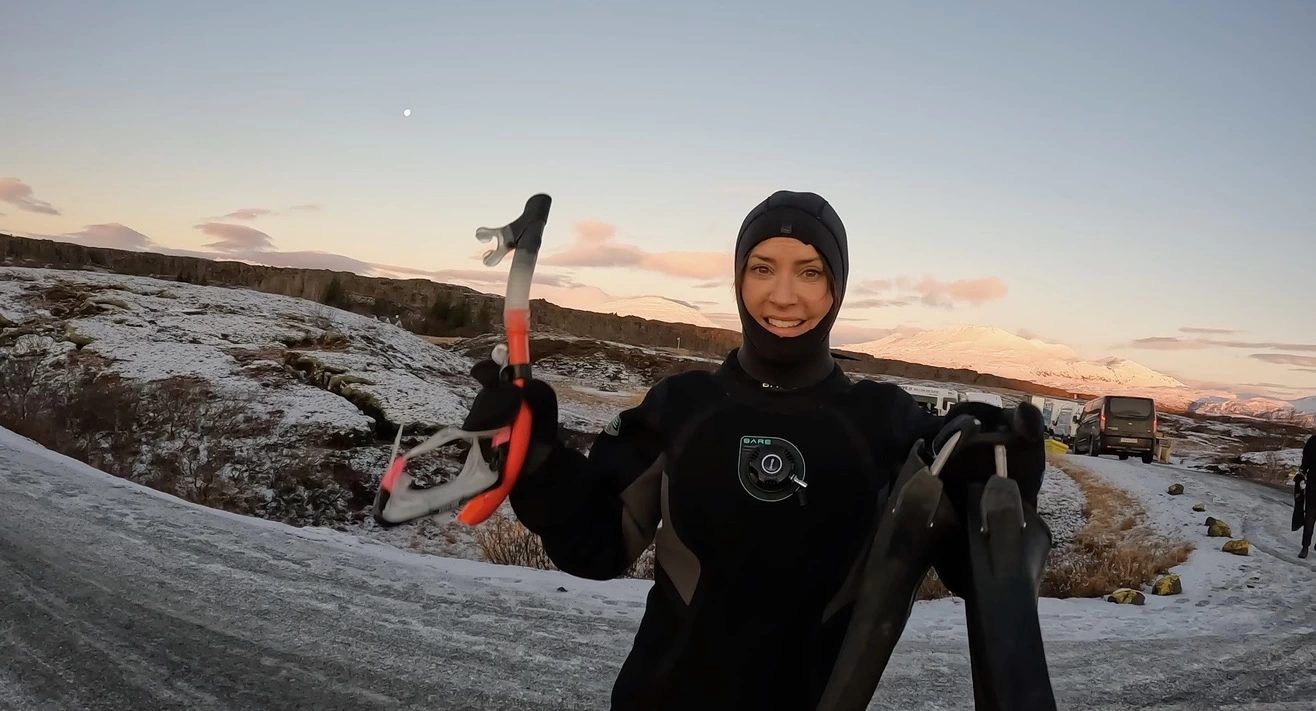 Karen Leblank, aka the Design Tourist, holding a snorkling tube and fins.