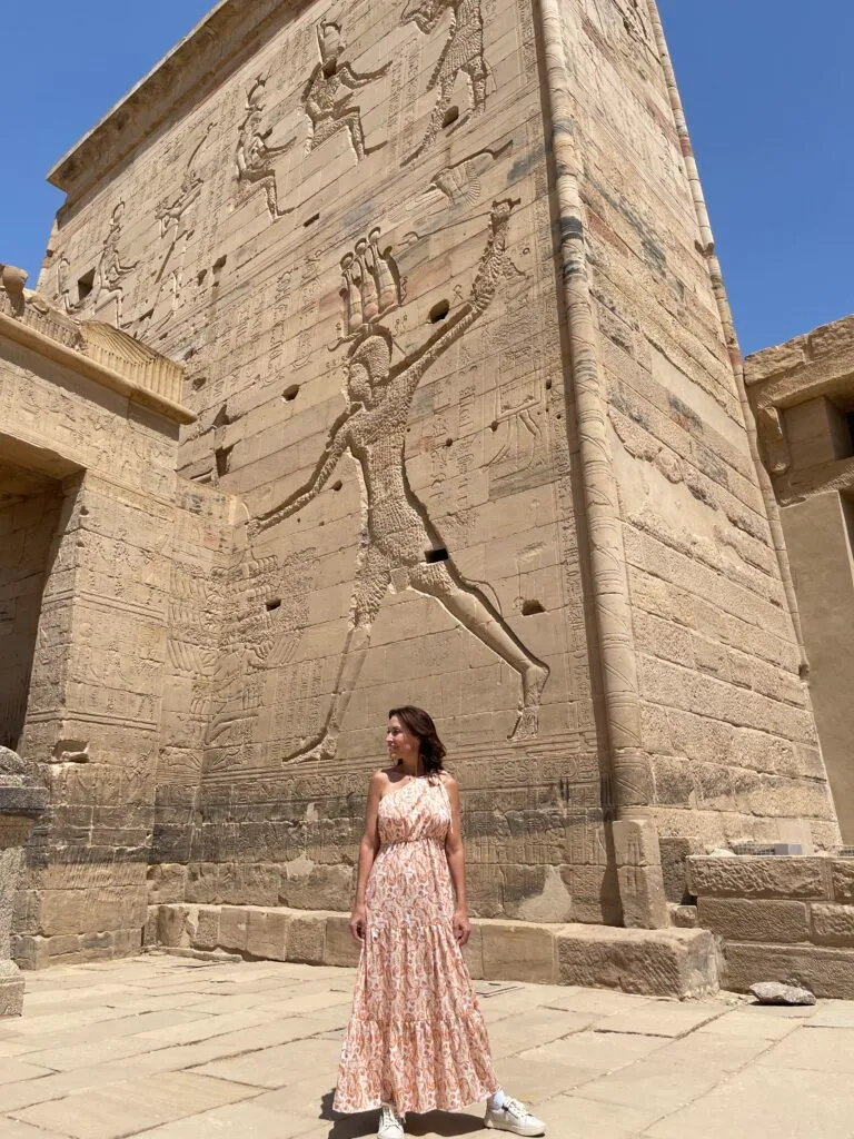 Karen standing in front of a stone building.