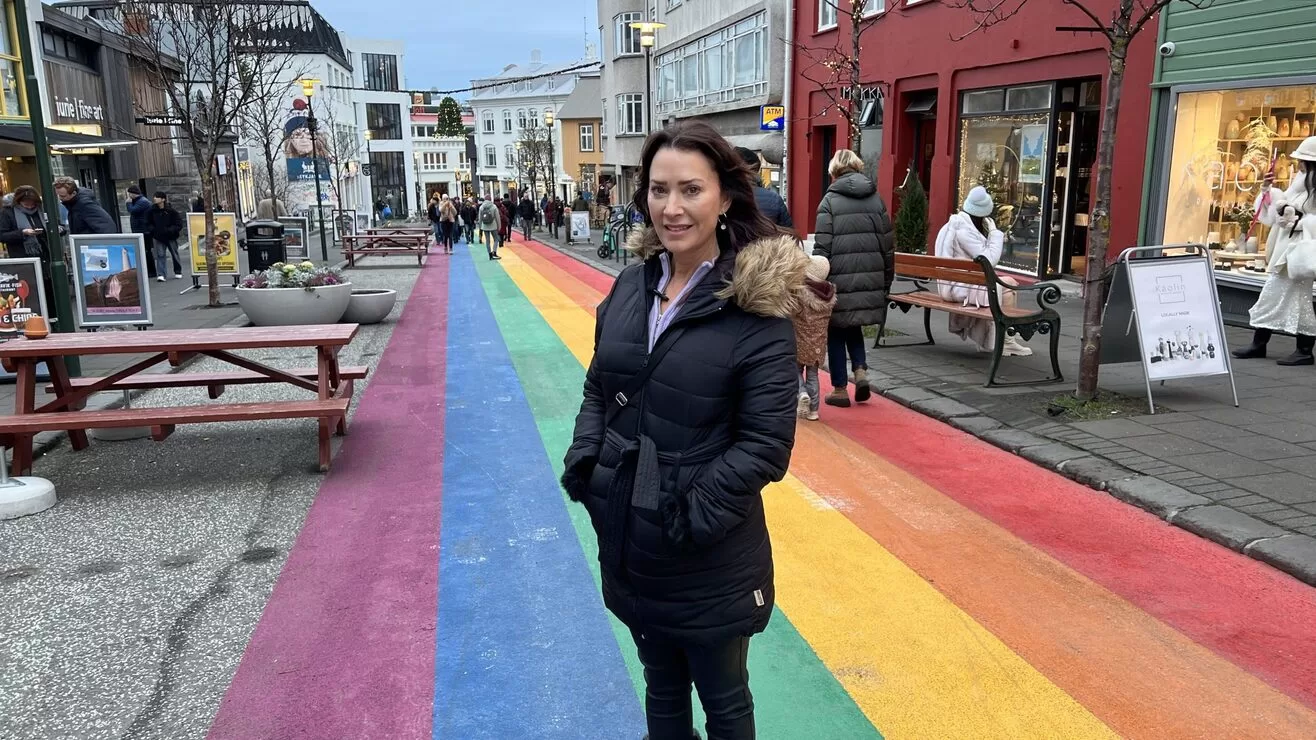 Travel writer Karen LeBlanc, aka The Design Tourist, is standing on Rainbow Street in downtown Reykjavík, Iceland.
