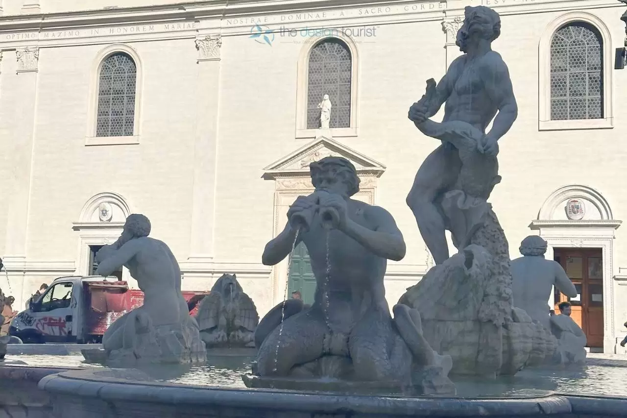 The Statue of Fontana del Moro, Piazza Navonan depicting a man playing a flute in a fountain.