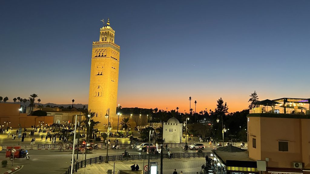 Sunset view of Koutoubia Mosque and city lights during 2 days in Marrakech, capturing the golden hour and evening atmosphere near the Medina.