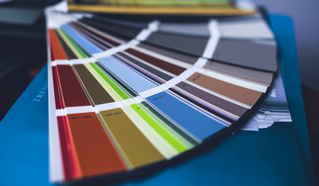 Close-up of fan deck with various paint color swatches