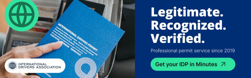 A promotional banner for the International Drivers Association. On the left, a hand holds a blue International Driving Permit booklet next to an open travel wallet and a green globe icon. On the right, bold white text on a dark blue background reads, "Legitimate. Recognized. Verified. Professional permit service since 2019," above a green button that says, "Get your IDP in Minutes." The image is shown within a website content editor with format adjustment tools visible at the top.